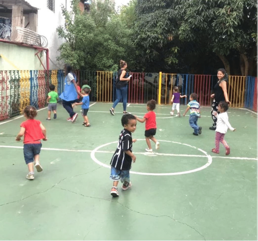 Children running on a soccer field