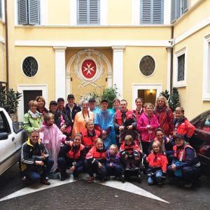 Group of young people with disabilities and their companions